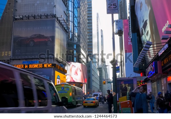 New York, USA - June 20, 2015: Walking through\
the streets of New York, Manhattan. The life of New York in the\
afternoon. Streets and city\
buildings.