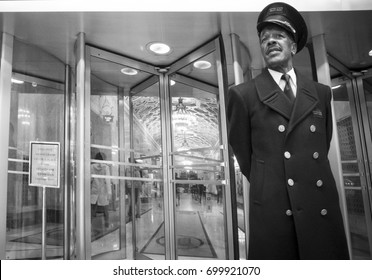 NEW YORK (USA) - JUNE 2015: Black And White Portrait Of A Doorman Outside A Building In Midtown Manhattan