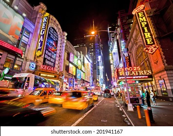 NEW YORK, USA - JUNE 28th 2014: Times Square and 42nd Street is a busy tourist intersection of neon art and commerce and is an iconic street of New York and America
