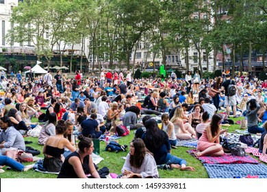 New York / USA - June 30 2019: People In Bryant Park Waiting For The Movie Night