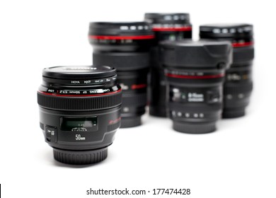 New York, USA - March 20, 2013: 50mm F/1.2 Canon EF Mount Lens Isolated On A White Surface And With Other Canon Lens At The Background