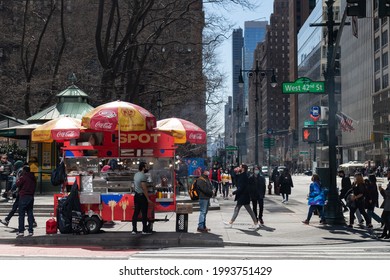 New York, New York USA - March 20 2021: Midtown Manhattan Street Crossing With A Hot Dog Vendor In New York City