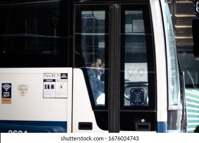 New York, USA / March, 2020 / Shot Of New York City Bus Driver On His Morning Commute. Shot Through The Window Of This Coach/bus. As He Battles With NY Traffic And The Morning Rush.