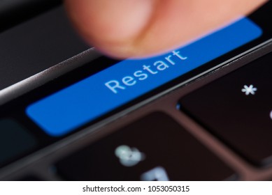 New York, USA - March 23, 2018: Press Restart Button On Touch Bar Of Macbook Latop Close Up