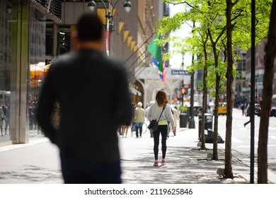 NEW YORK , USA - MAY 11 2021: Crowd Of People Walking Down The Street On A Sunny Day In NYC, America. The Bustling Life Of A Big City