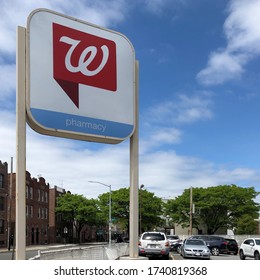 New York, New York / USA - May 24 2020: Walgreens sign in the parking lot of a pharmacy location in Queens, NYC