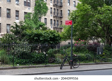 New York, New York USA - May 24 2021: Small Park Along A Street In Greenwich Village With An Old Apartment Building In New York City