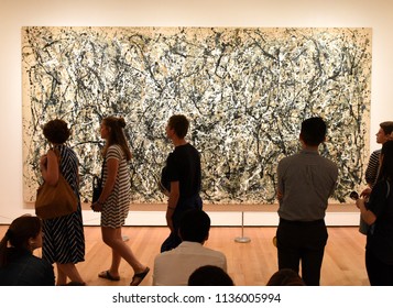 New York, USA - May 25, 2018: A Visitors Looks At The Jackson Pollock Painting In Museum Of Modern Art In New York City.