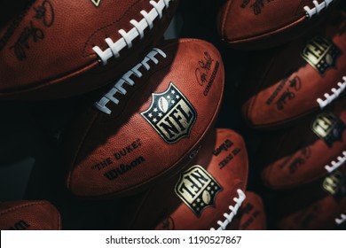New York, USA - MAY 28, 2018: Rows of american football balls in NFL Experience in Times Square, New York, a first-of-its-kind live action attraction, combining interactive games and 4D theatre.