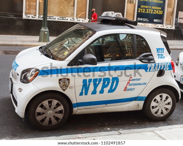 New York, New York, USA - May 30, 2018: A\
small NYPD police car parked in\
Manhattan.