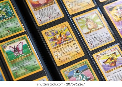 New York, USA - November 10, 2021 : 1995 Pokemon Cards, Pokemon Cards Distributed On The White Table. Collectible Cards 1995