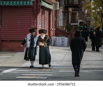 NEW YORK. USA - NOVEMBER 18, 2019: Hasidic Jews walk to a temple on the sabbath in Williamsburg Brooklyn on November 18, 2019, in New York, USA.
