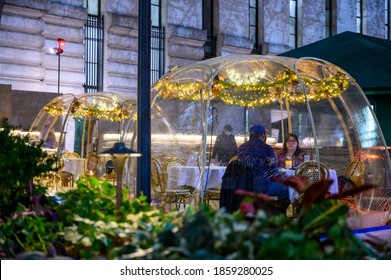 New York, New York, USA - November 20, 2020: People Can Be Seen In An Outdoor Dining Bubble Or Igloo At Bryant Park During The Pandemic.