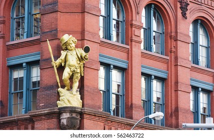 New York, USA, November 2016: A Golden Puck Statuette By Henry Baerer Decorating The Puck Building On Lower Manhattan