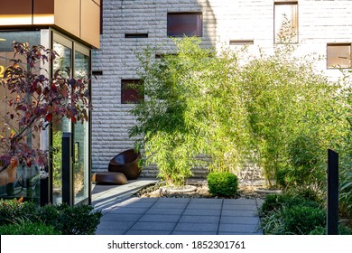 New York / USA - November 9 2020: An Entrance Into An Apartment Building In Manhattan, NYC. Plants Around The Entrance