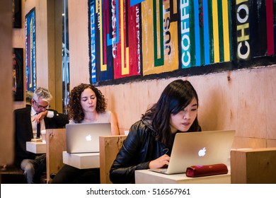 NEW YORK, USA - October 13, 2016. People Working On Computers In A Cafe In Greenwich Village, NYC.