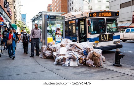 New York / USA - October 15 2019: Bags With Paper In Front Of Bus Stop