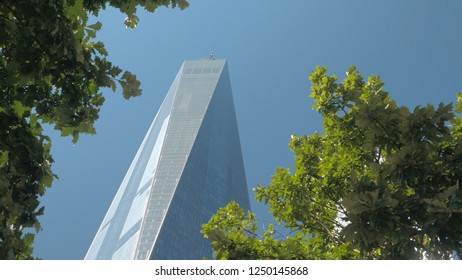 NEW YORK USA - OCTOBER 2, 2016: CLOSE UP, LOW ANGLE VIEW: Supertall Main Building Of Rebuilt World Trade Center Complex Against Blue Sky. Famous Freedom Tower In Lower Manhattan 