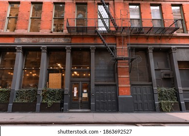 New York, New York USA - October 5 2020: Store Front In SoHo Of New York City Along An Empty Sidewalk And In A Beautiful Old Building