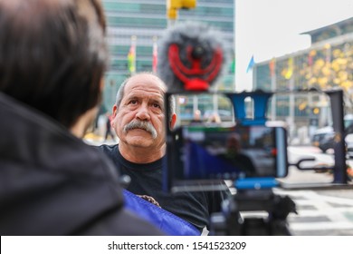 New York, USA, Oktober 25, 2019 Peaceful Chile Demonstration Opposite The UN Building. Protestors Are Demonstrating Against The Rising Cost Of Living And Income Inequality By Banging Kitchen Pots.