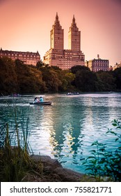 New York, USA - People Boating On A Lake At Central Park, On A Summer Evening