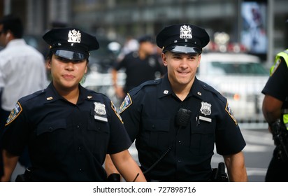 NEW YORK, USA - Sep 21, 2017: Police officers performing his duties on the streets of Manhattan. New York City Police Department (NYPD) is the largest municipal police force in the United States