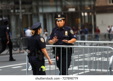 NEW YORK, USA - Sep 21, 2017: Police officers performing his duties on the streets of Manhattan. New York City Police Department (NYPD) is the largest municipal police force in the United States
