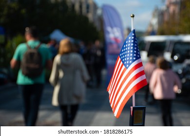 New York, USA - September 19 2020: American Flag Waving On The Car On The 4th Of July, Thanksgiving Day Or During United States Presidential Election, 11 September, With People And Cars On Background