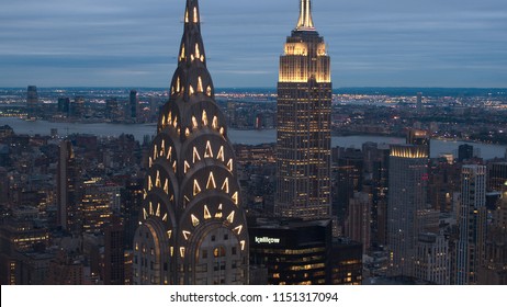 NEW YORK USA - SEPTEMBER 23 2016: illuminated NYC skyscrapers in Midtown Manhattan with deleted and blurred logos on summer evening. Copyright-free New York City skyline shining at night