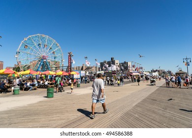 New York, USA - September 23, 2015: People Walking Long Riegelmann Boardwalk