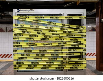 New York, New York, USA - September 26, 2020: Caution Tape Over An MTA Subway Transit Map Whose Glass Covering Has Been Shattered.