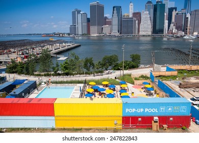 New York, USA-July 29,2013. Public Swimming Pool In Front Of The Skyscrapers In Manhattan