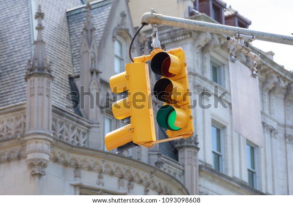New York yellow\
traffic light at Museum\
mile