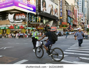 NEW YORK, NEW YORK/USA - July 2, 2019: NYPD Traffic Agent Does His Work While Adding A Touch Of Style And Humor To Brighten Up Busy NYC Street.