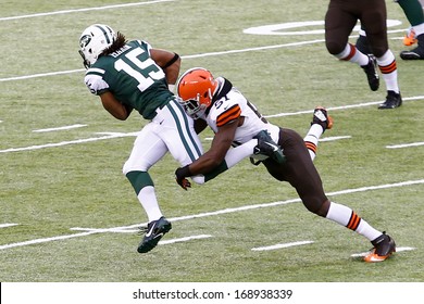 NEW YORK-DEC 22: Cleveland Browns outside linebacker Barkevious Mingo (51) attempts to tackle New York Jets wide receiver Saalim Hakim (15) during the first half at MetLife Stadium. 