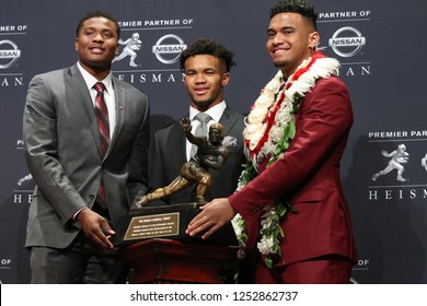 NEW YORK-DEC 8: (L-R) Ohio State Buckeyes Quarterback Dwayne Haskins, Oklahoma Sooners Quarterback Kyler Murray And Alabama Crimson Tide Quarterback Tua Tagovailoa With The Heisman Trophy In New York.