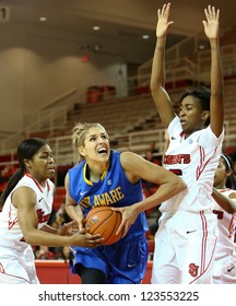 NEW YORK-JAN 2: Delaware Blue Hens Guard Elena Delle Donne (11) Shoots As St. John's Red Storm Guard Shenneika Smith (35) Defends At Carnesecca Arena On January 2, 2013 In Jamaica, New York.