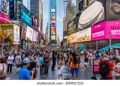 NEW YORK-JULY 24: A Large Crowd Enjoys The Day On July 24 2015 In Times Square In Manhattan.