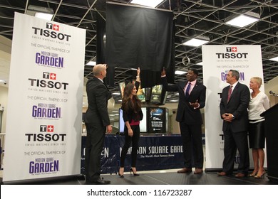 NEW YORK-OCT 25:Adam Graves, Danica Patrick And Larry Johnson Unveil The New Tissot Swiss Watches Lobby Clocks At Madison Square Garden Box Office On October 25, 2012 In New York City.