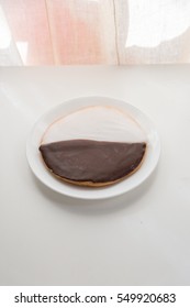 New York's Famous Black And White Cookie On White Table