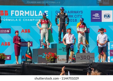 New York/United States-July 15 2018
Formula E New York Grand Prix Winner In Podium, From Left Luca Di Grassi (2nd), Jean Eric Vergne (1rst) And Daniel ABT (3rd)