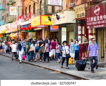 NEW YORK,USA - AUGUST 15,2015 : Tourists And Chinese Immigrants At Chinatown In New York City