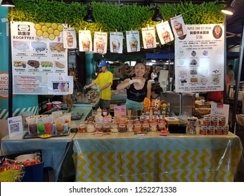 NEW ZEALAND, AUCKLAND - JANUARY 2018: An Unidentified Young Woman Sells Asian Street Dessert At A Auckland Local Night Market. Night Markets Are Popular Among Tourists And Locals.