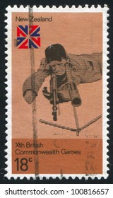 NEW ZEALAND - CIRCA 1974: Stamp Printed By New Zealand, Shows Rifle Shooting And British Commonwealth Games Emblem, Circa 1974