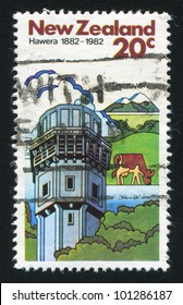 NEW ZEALAND - CIRCA 1982: A Stamp Printed By New Zealand, Shows Cows And Dairy Factory In Hawera, Circa 1982