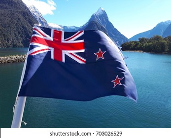 New zealand flag, flag with sea background, blue red white in nz flag, clear ocean with snow-capped mountain