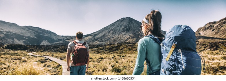 New Zealand Hiking Couple Backpackers Tramping At Tongariro National Park. Male and female hikers hiking by Mount Ngauruhoe. People living healthy active lifestyle outdoors - Shutterstock ID 1488680534