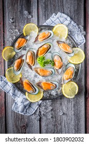 New Zealand imported big Mussels on ice with the slice lemons.