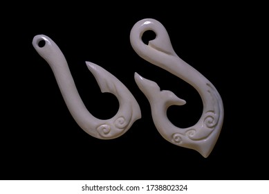 New Zealand Maori Handmade Carved Ox Bone Necklace Isolated On A Black Background.