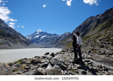 NEW ZEALAND, SOUTH ISLAND, MOUNT COOK - FEBRUARY 2016: An Unidentified Couple Explores Mount Cook,New Zealand. Working Holiday Visa Is A Popular Way To Explore New Zealand And Other Countries.